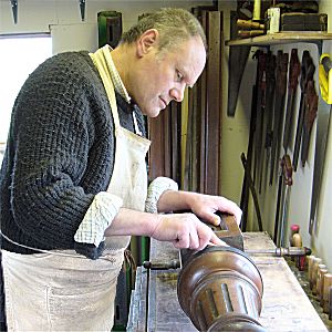 Harvey working on a billiard table leg, photo Dave Cushman